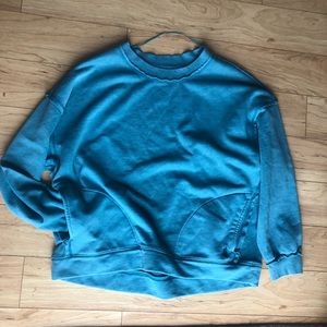 Free people medium movement solid metti crew sweatshirt In a aqua teal blue.